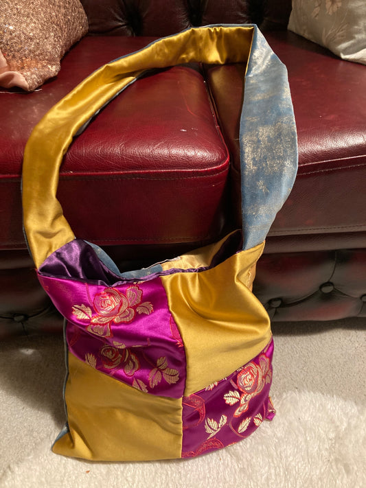 Purple and gold crossbody bag