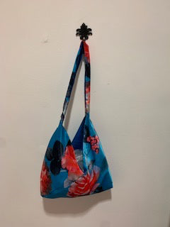 Small bright blue with red flowers. Evening