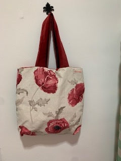 Cream with large red poppies. Short red velour straps