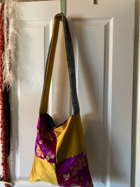 Purple/gold. Four sqs, long strap, cross body, gold and blue