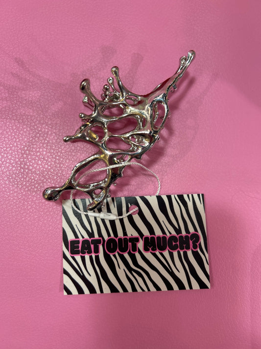 Irregular metal hair clip.