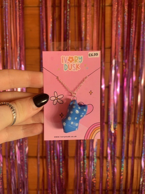 upcycled polly pocket swimming costume necklace.
