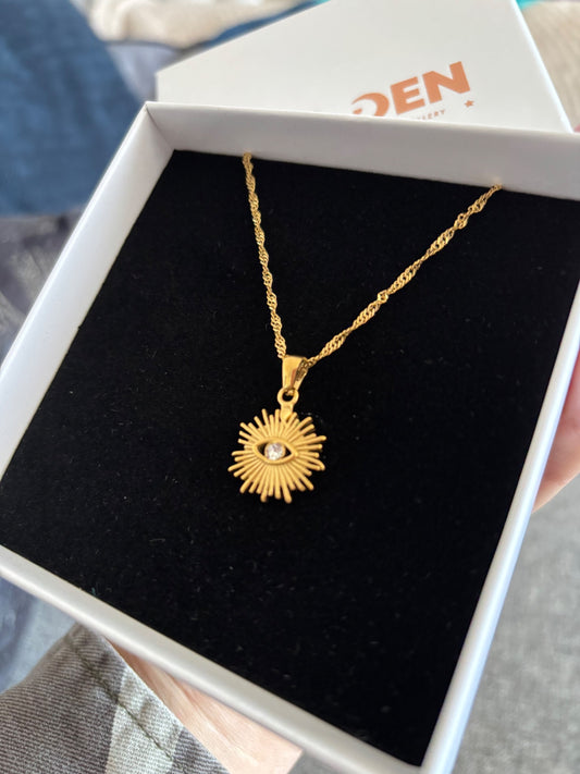 Sunburst crystal eye gold necklace