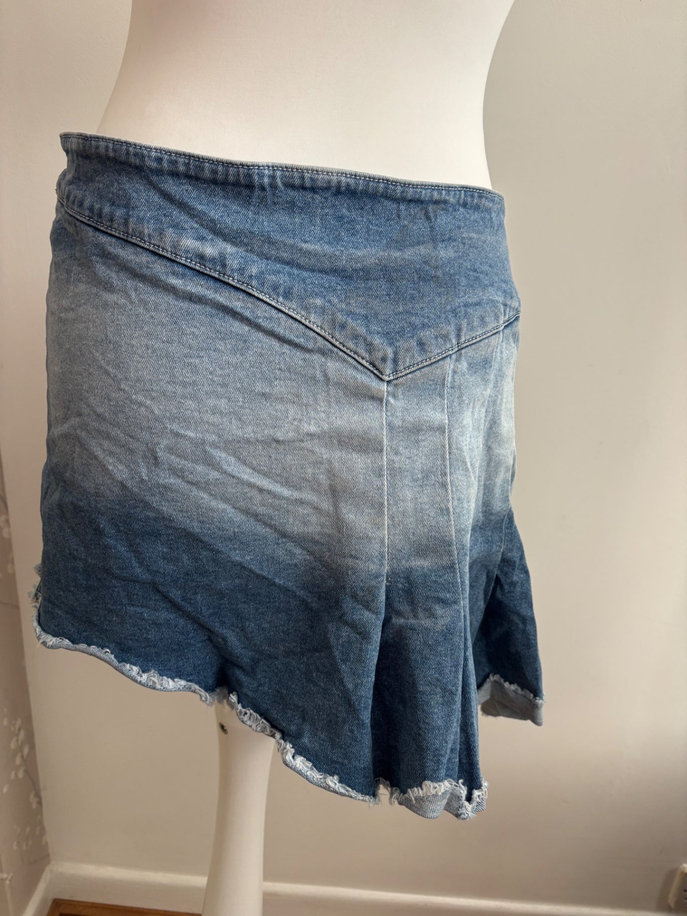 Pleated asymmetrical denim skirt