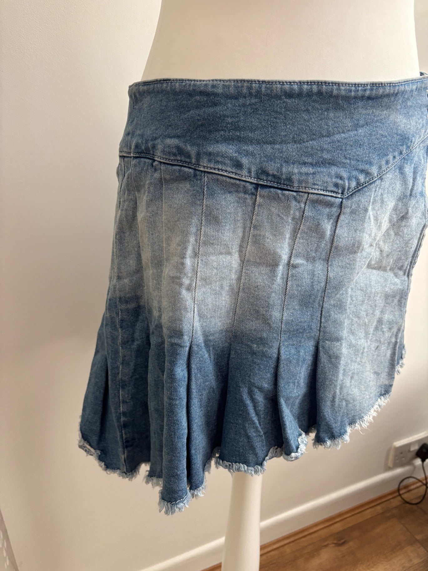 Pleated asymmetrical denim skirt