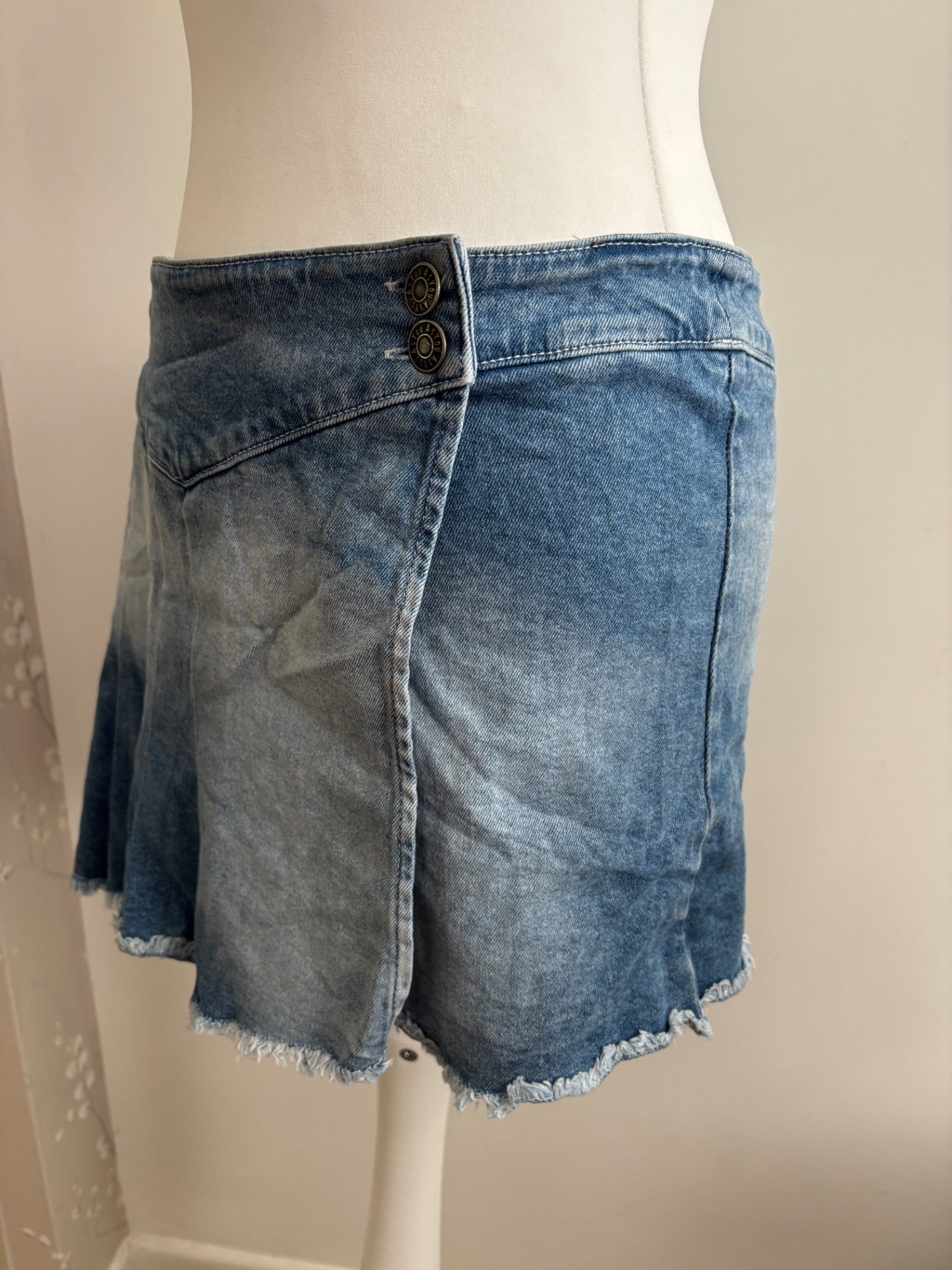 Pleated asymmetrical denim skirt