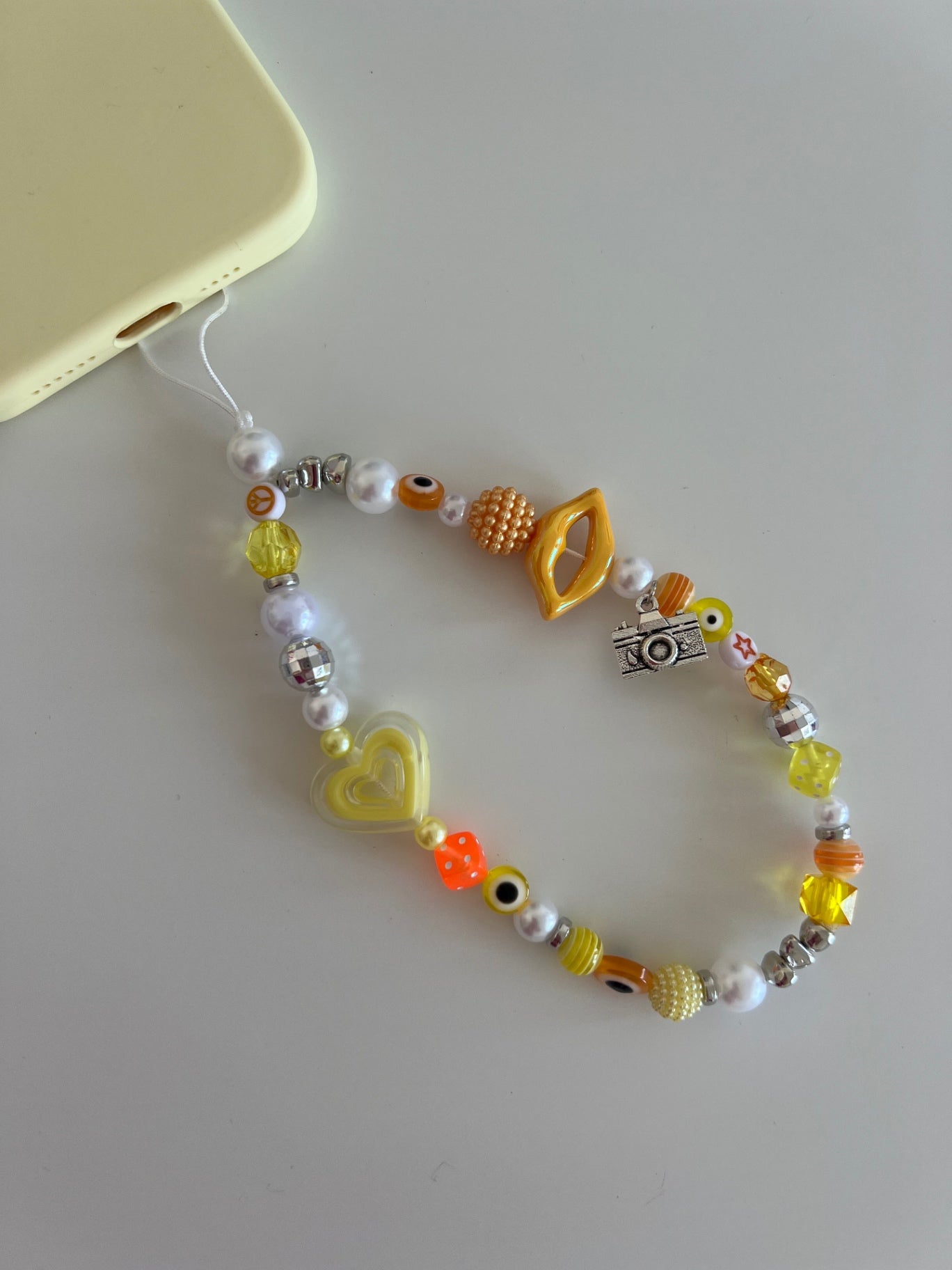 Confidence phone charm - yellow/orange (silver)