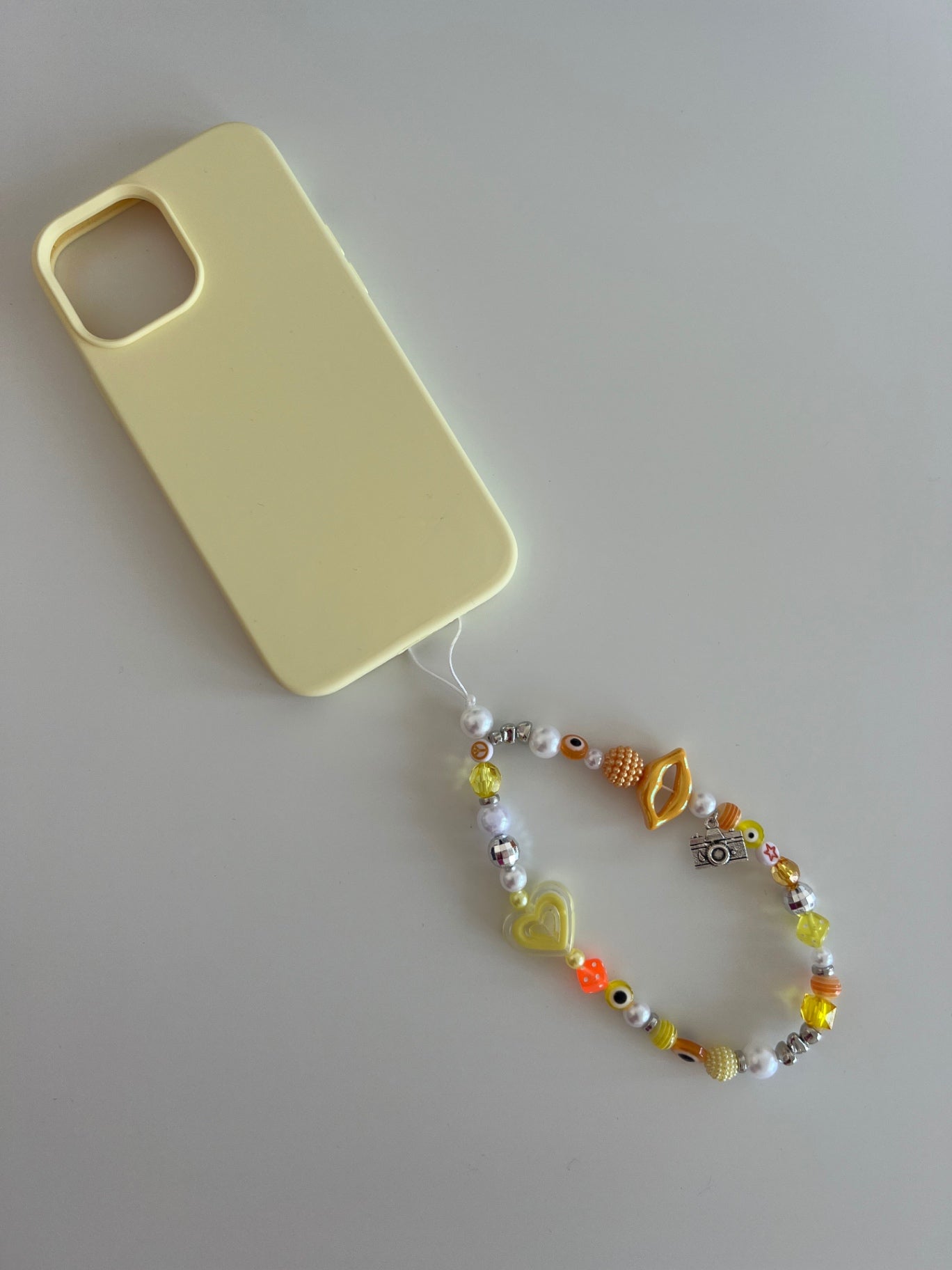 Confidence phone charm - yellow/orange (silver)
