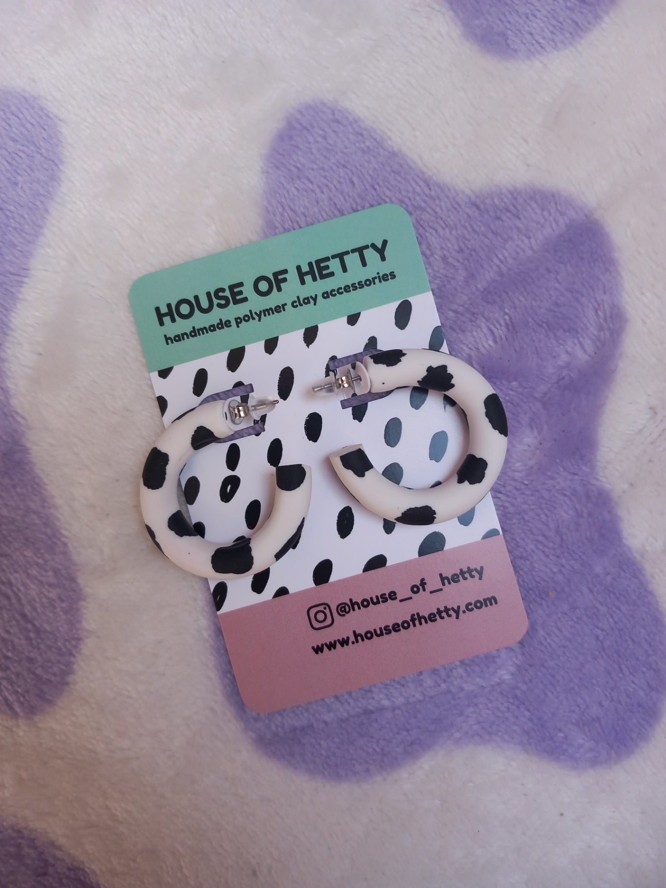 Small polymer clay cow print hoop earrings