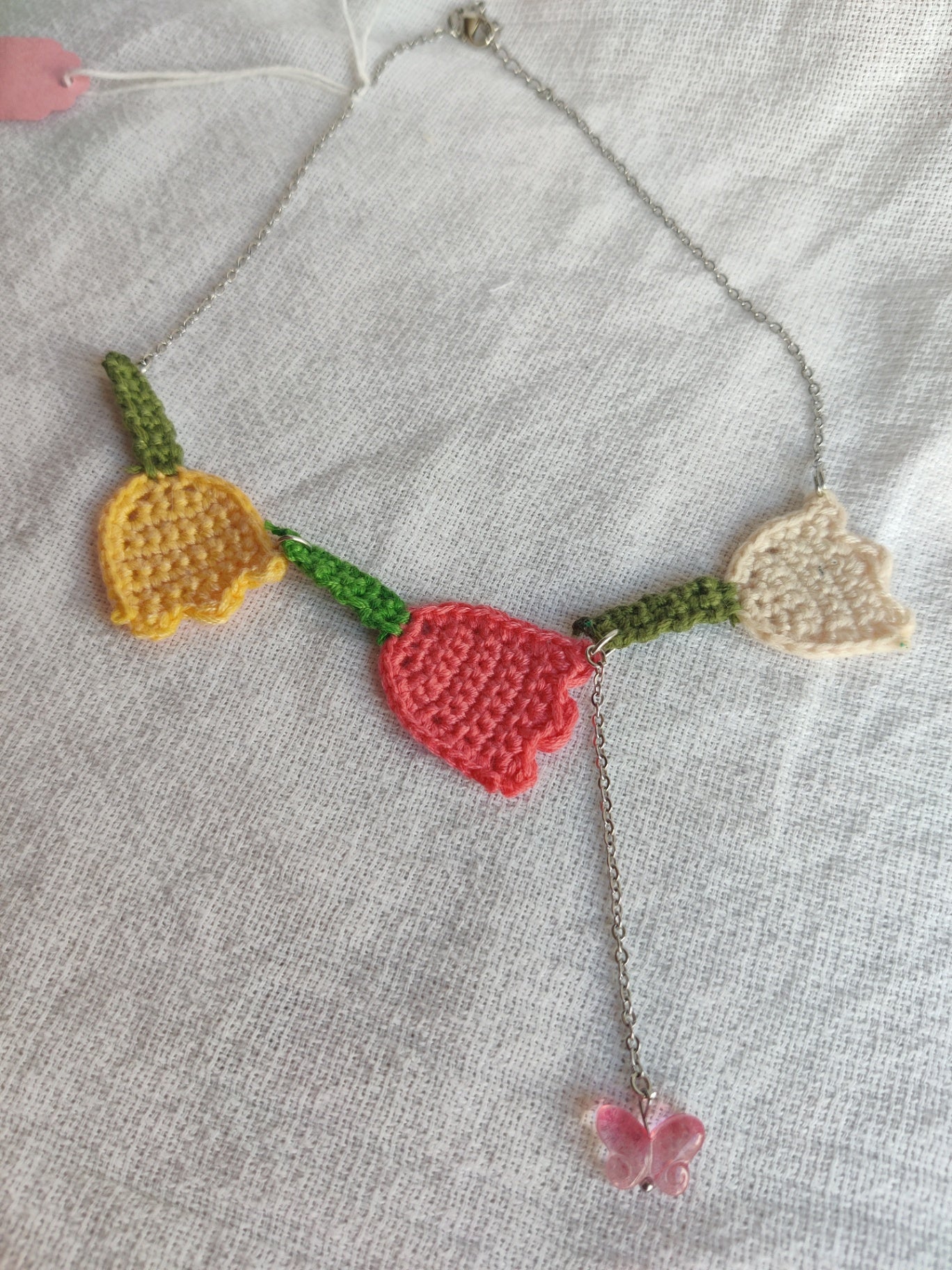 Crochet tulip necklace with glass butterfly bead