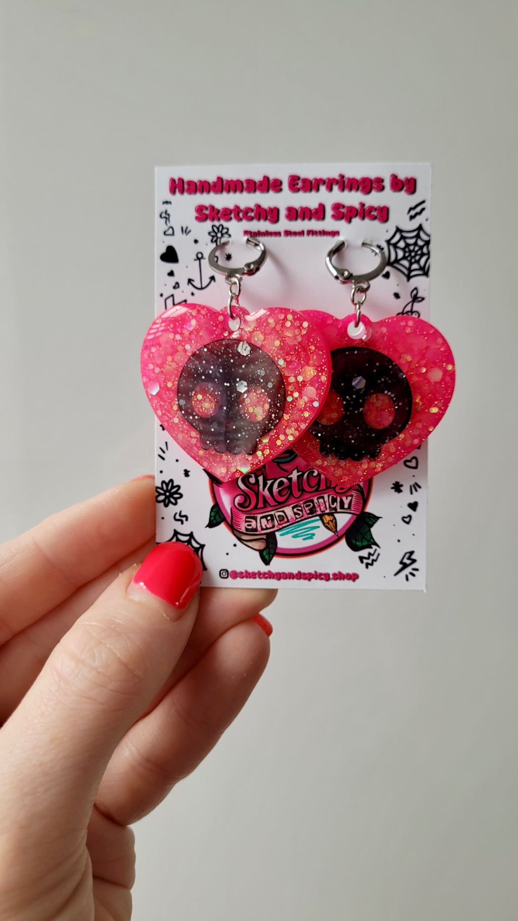 Pink Glitter Heart Earrings with Black Skulls – Stainless Steel Hoops