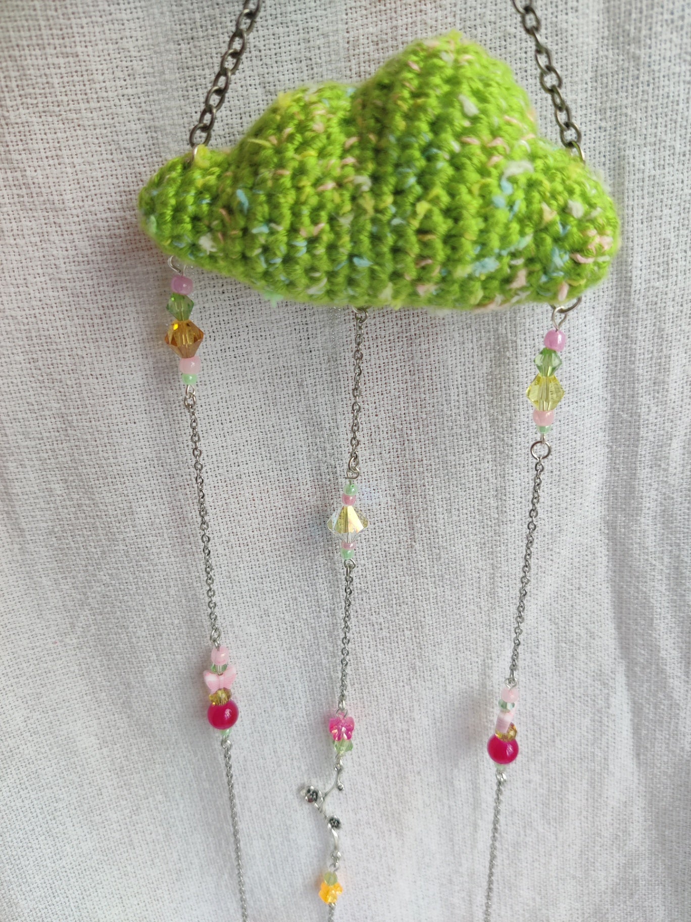 Green crochet cloud suncatcher and