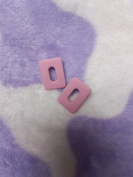 Light pink textured rectangle statement studs.
