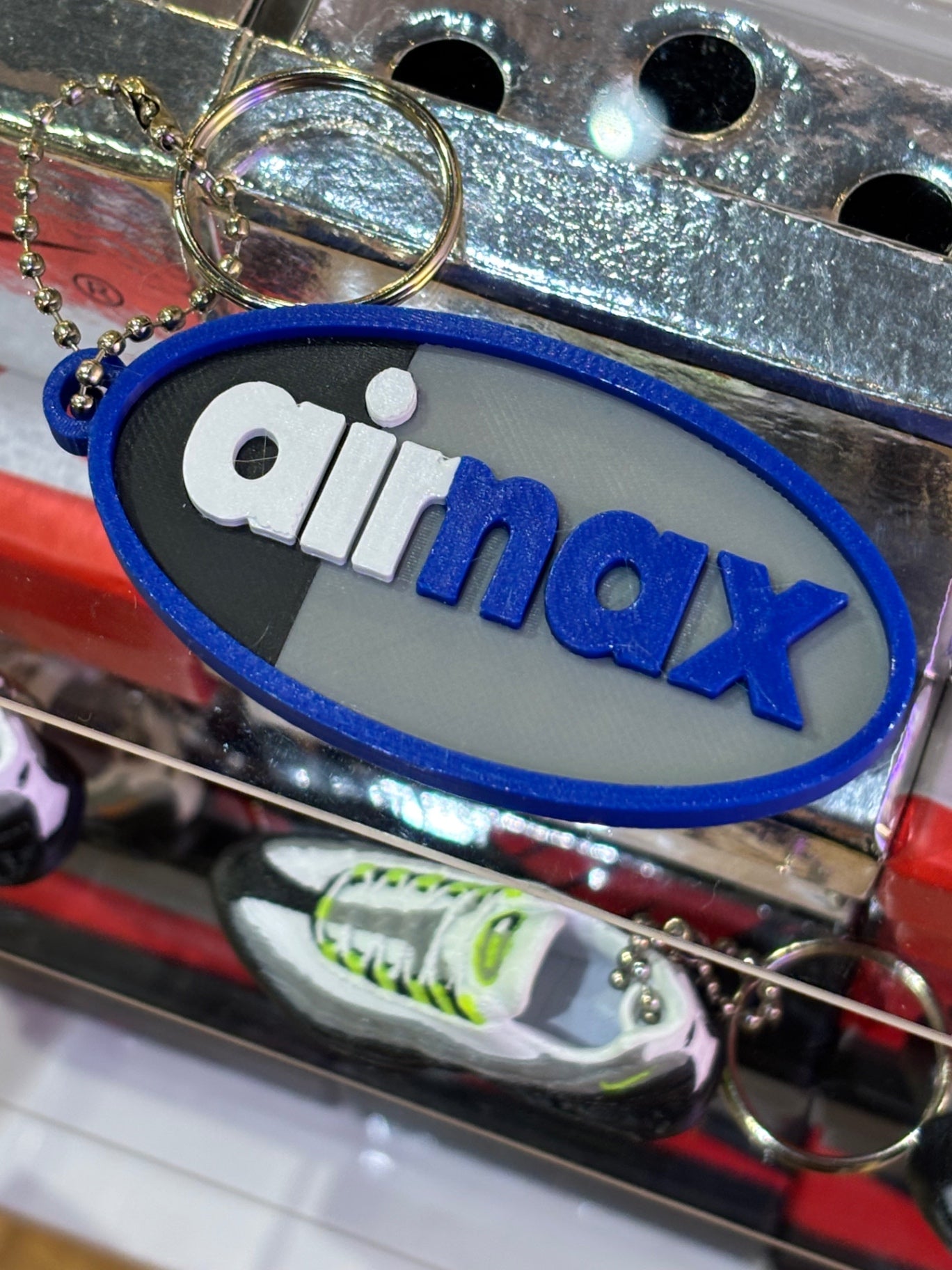 110 logo keychain blue