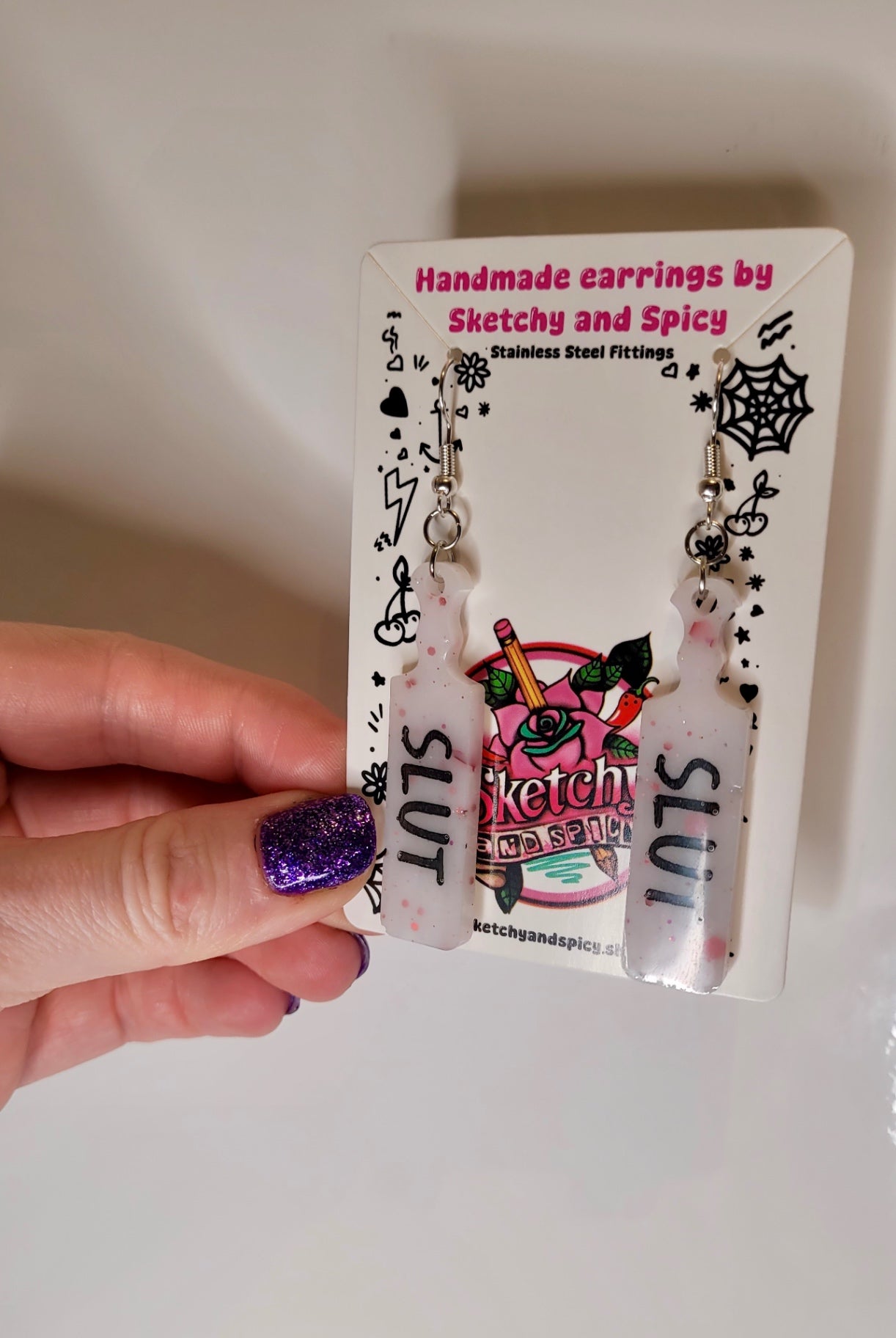 White with Red Flecks SLUT paddle earrings