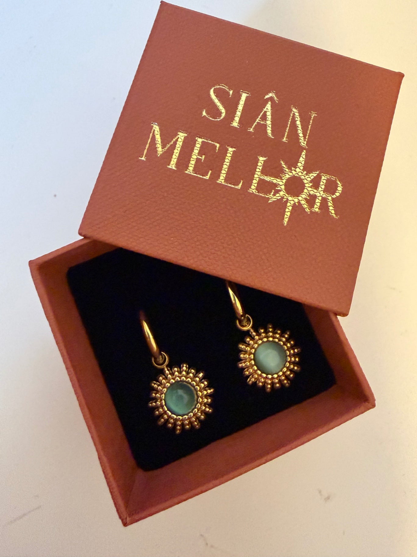 Blue and gold sun hoop earrings