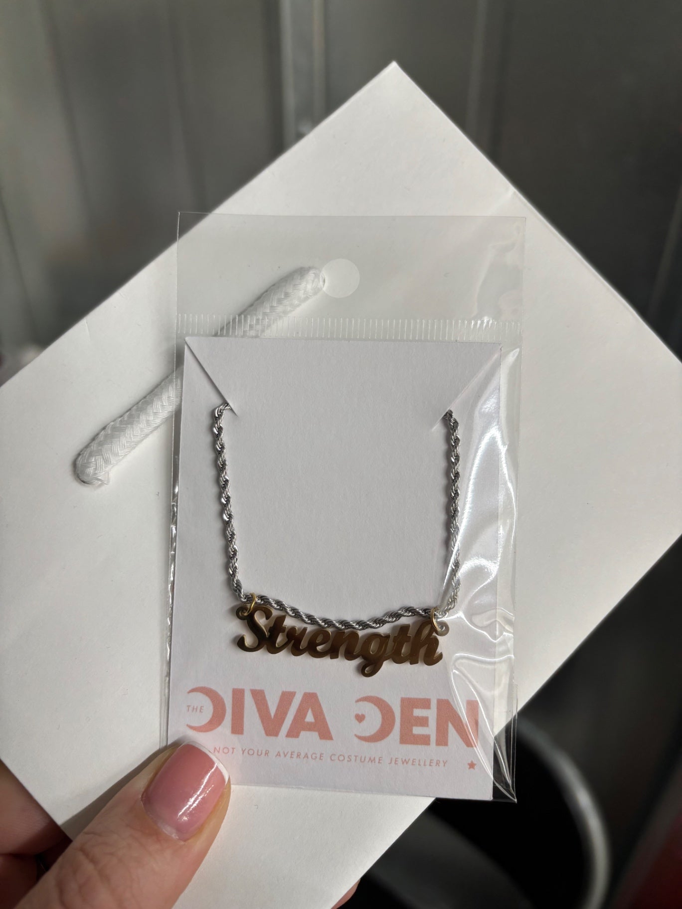 Mixed metal STRENGTH necklace