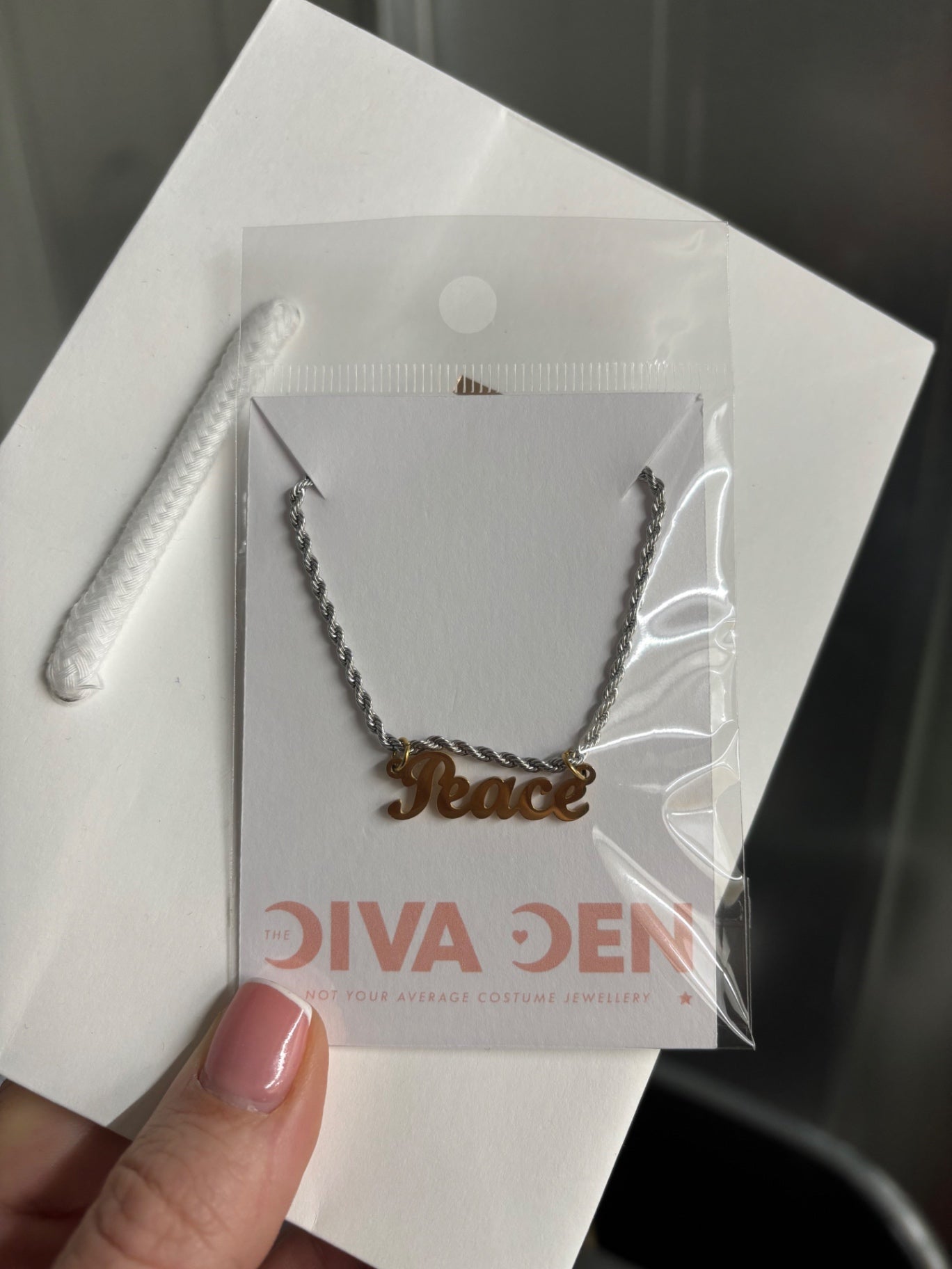 Mixed metal PEACE necklace