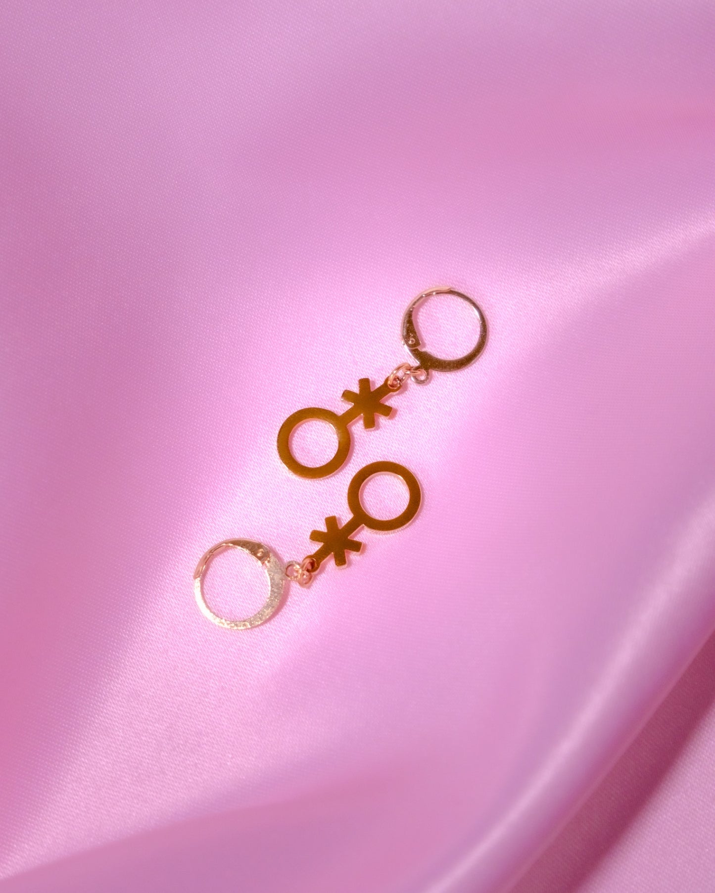 Gold non binary symbol huggie hoops
