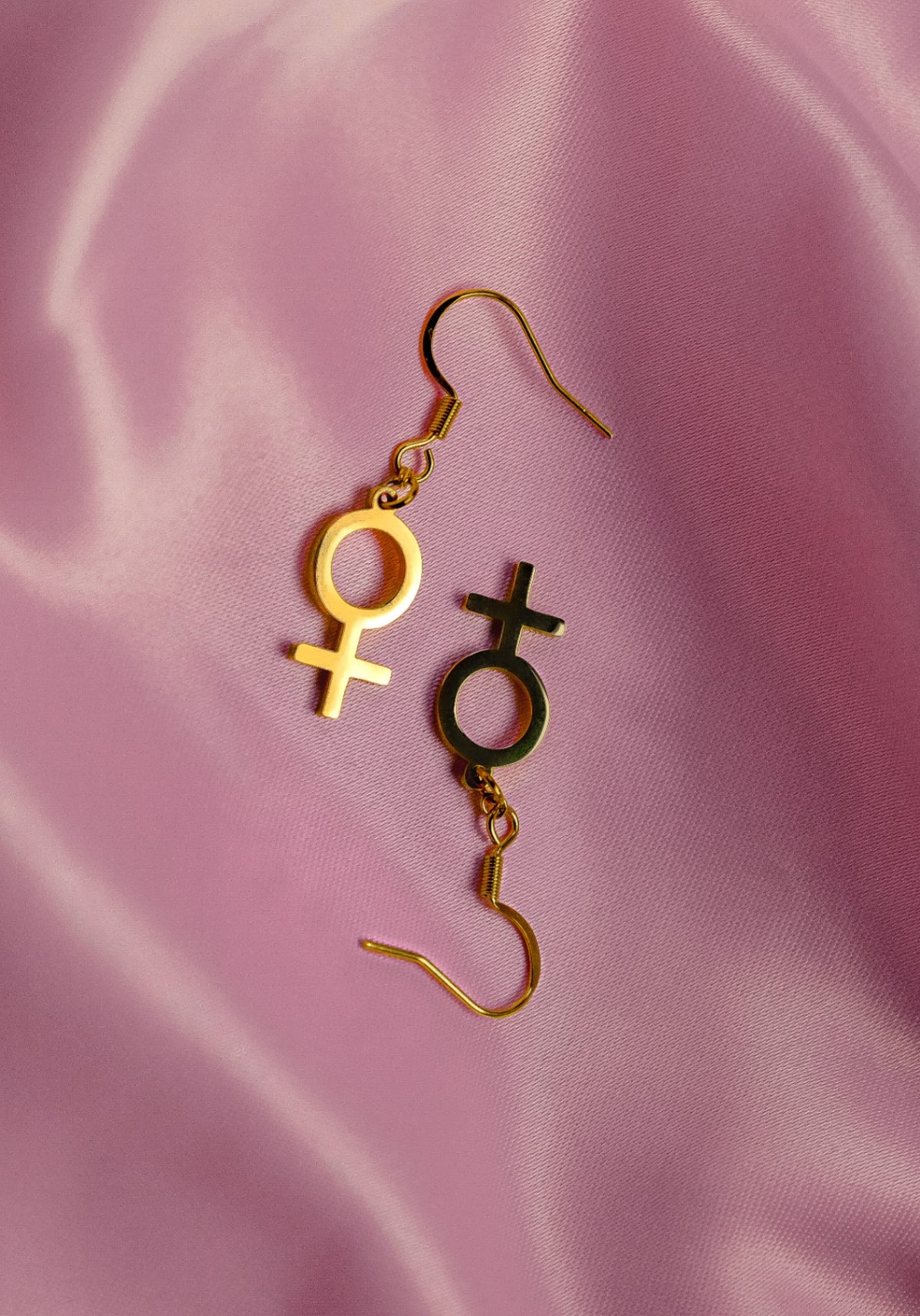 Gold venus symbol earrings