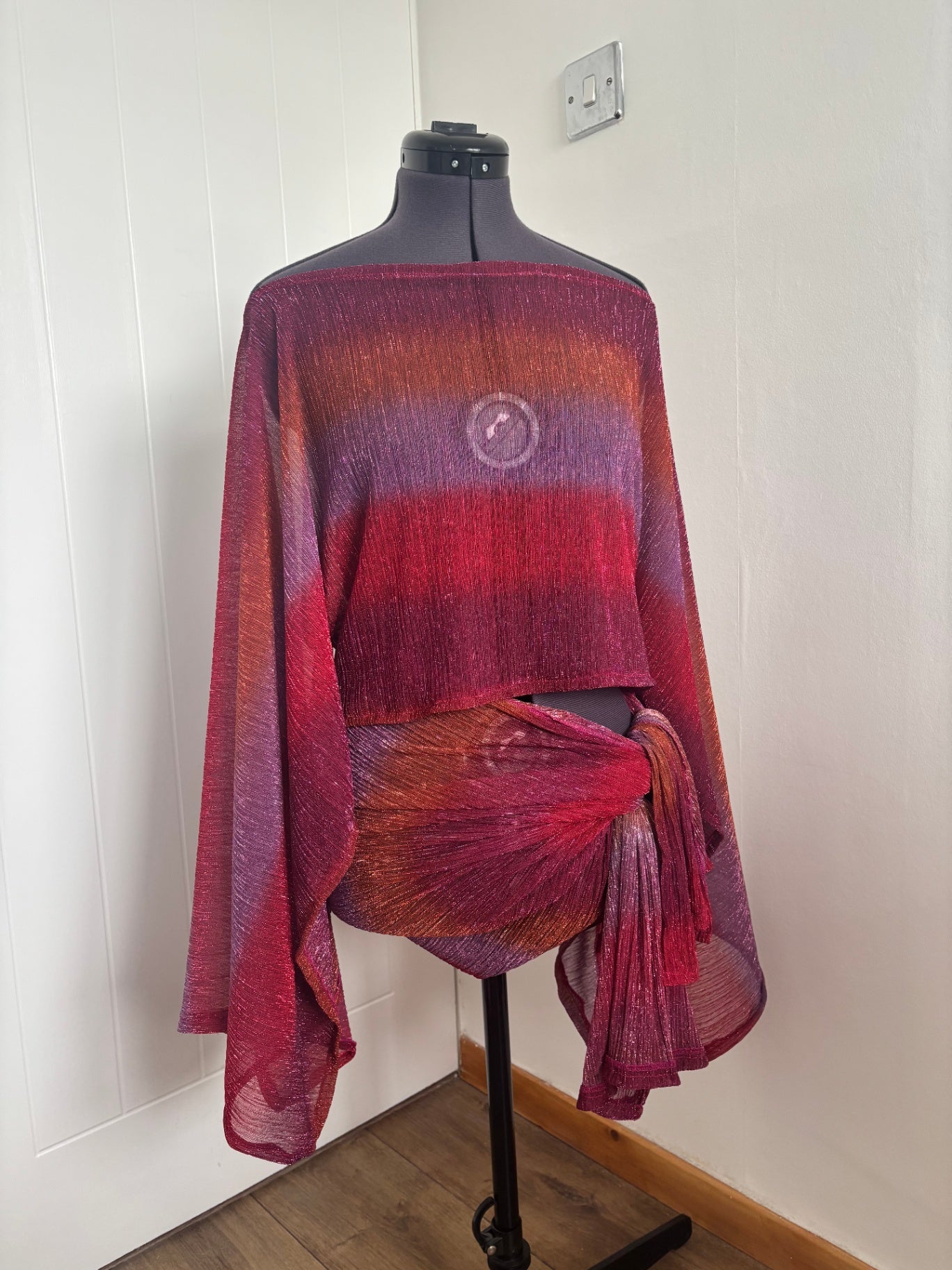 Pink poncho top & sarong skirt