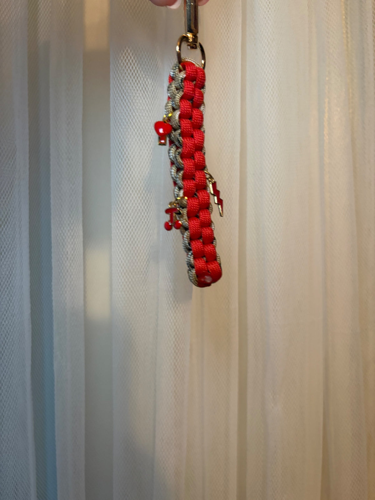 Red and beige charm keychain