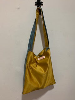 Small bag, gold satin/ blue velour each side. Short blue/gold strap.