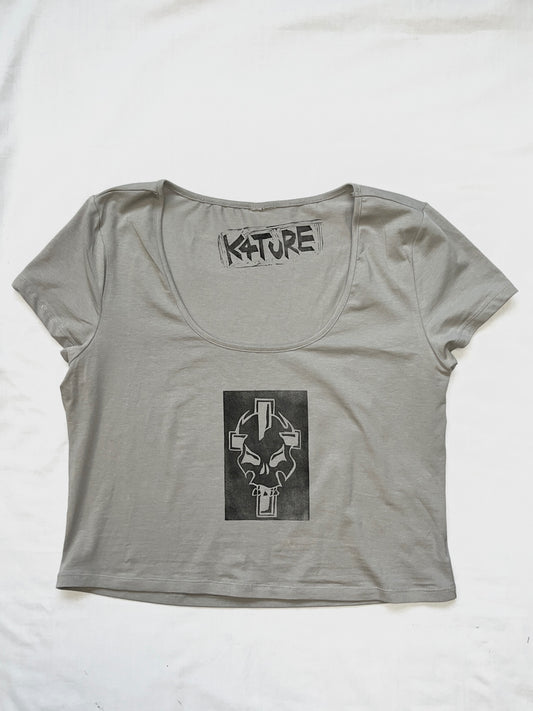 Grey crop top with skull and cross design 