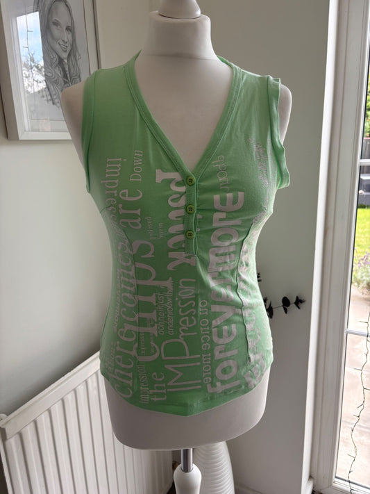 Green top with writing on