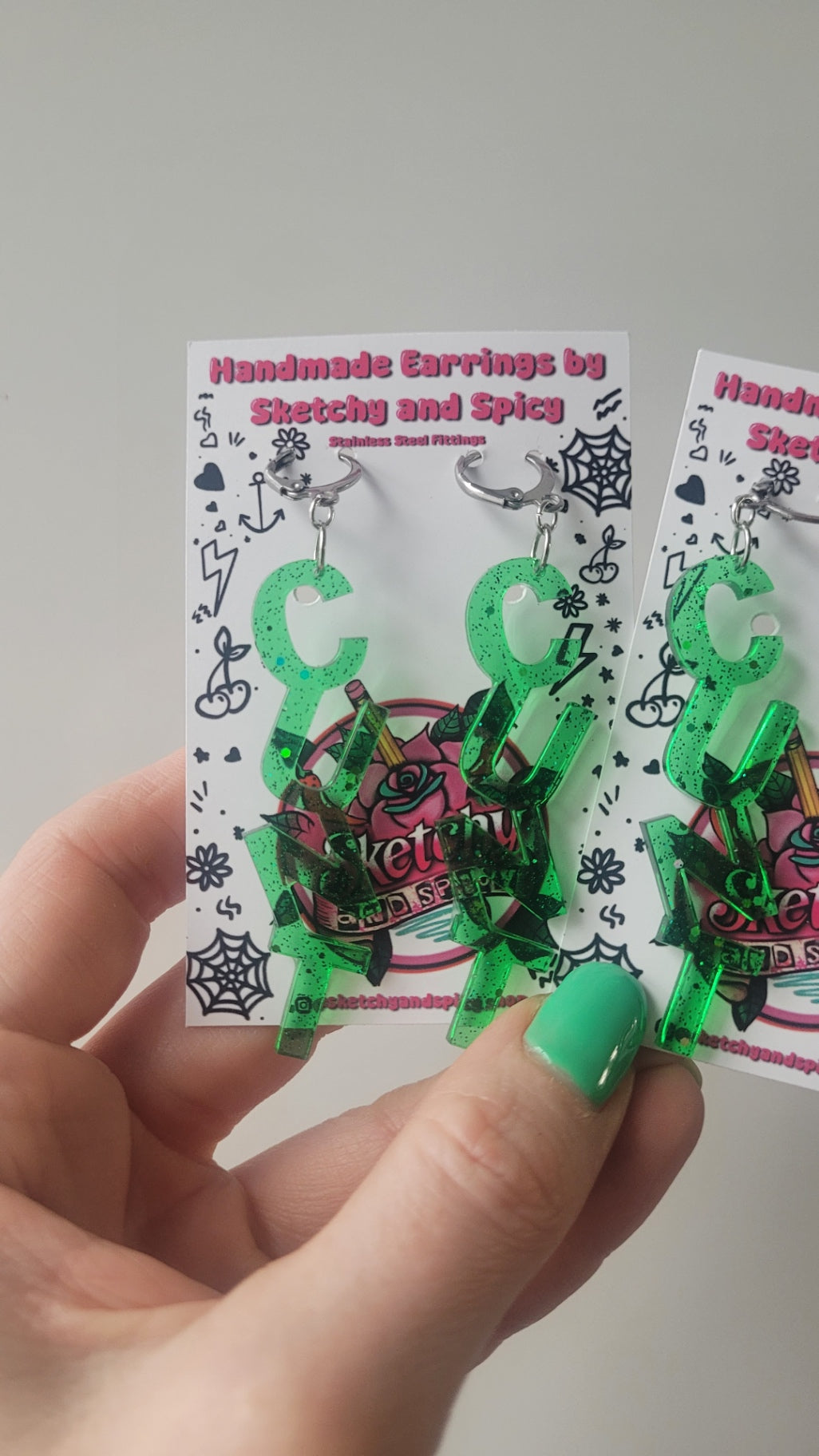 NT Green Glitter Earrings – Stainless Steel Silver Hoops