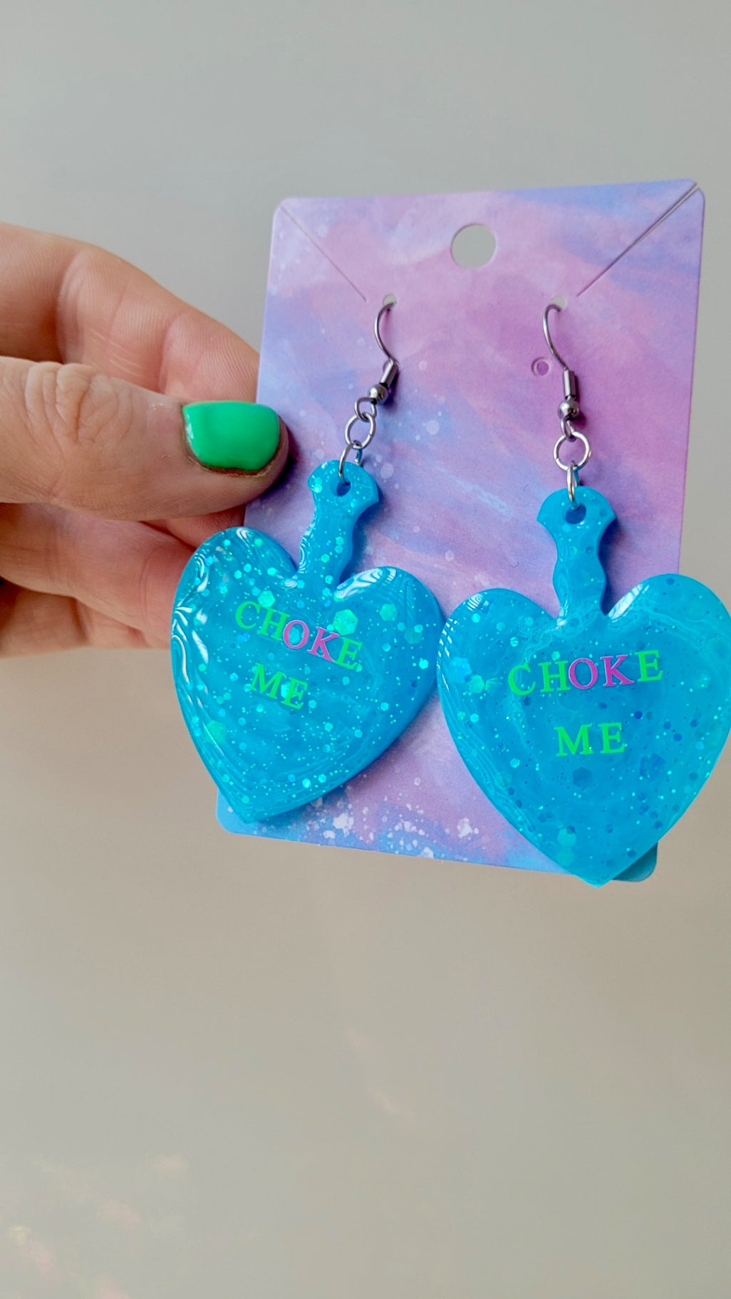 CHOKE ME Light Blue Glitter Heart Paddle Earrings with Green & Pink Text - Stainless Steel Hooks