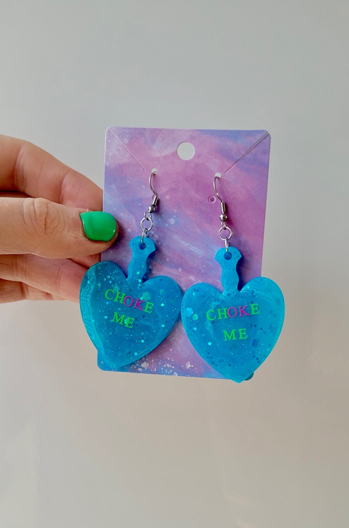 CHOKE ME Light Blue Glitter Heart Paddle Earrings with Green & Pink Text - Stainless Steel Hooks