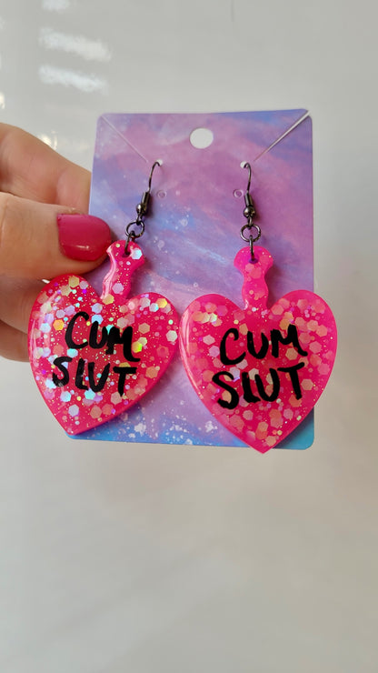 Hot Pink Glitter Heart Paddle Earrings – CUM SLUT - Gunmetal Hooks