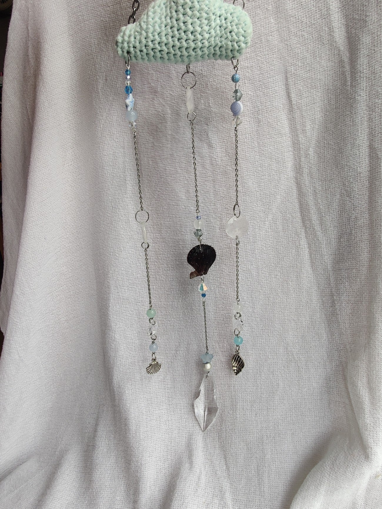 Crochet cloud suncatcher with shell