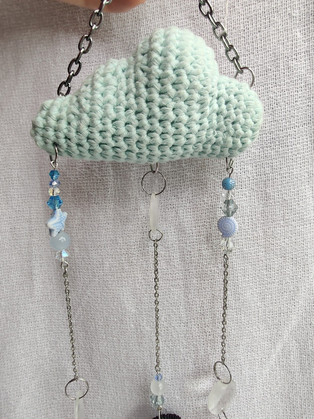 Crochet cloud suncatcher with shell