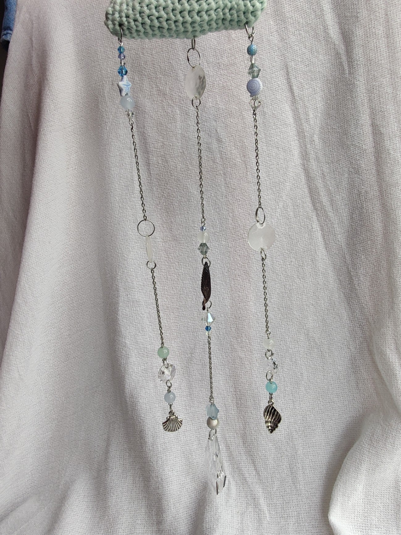 Crochet cloud suncatcher with shell