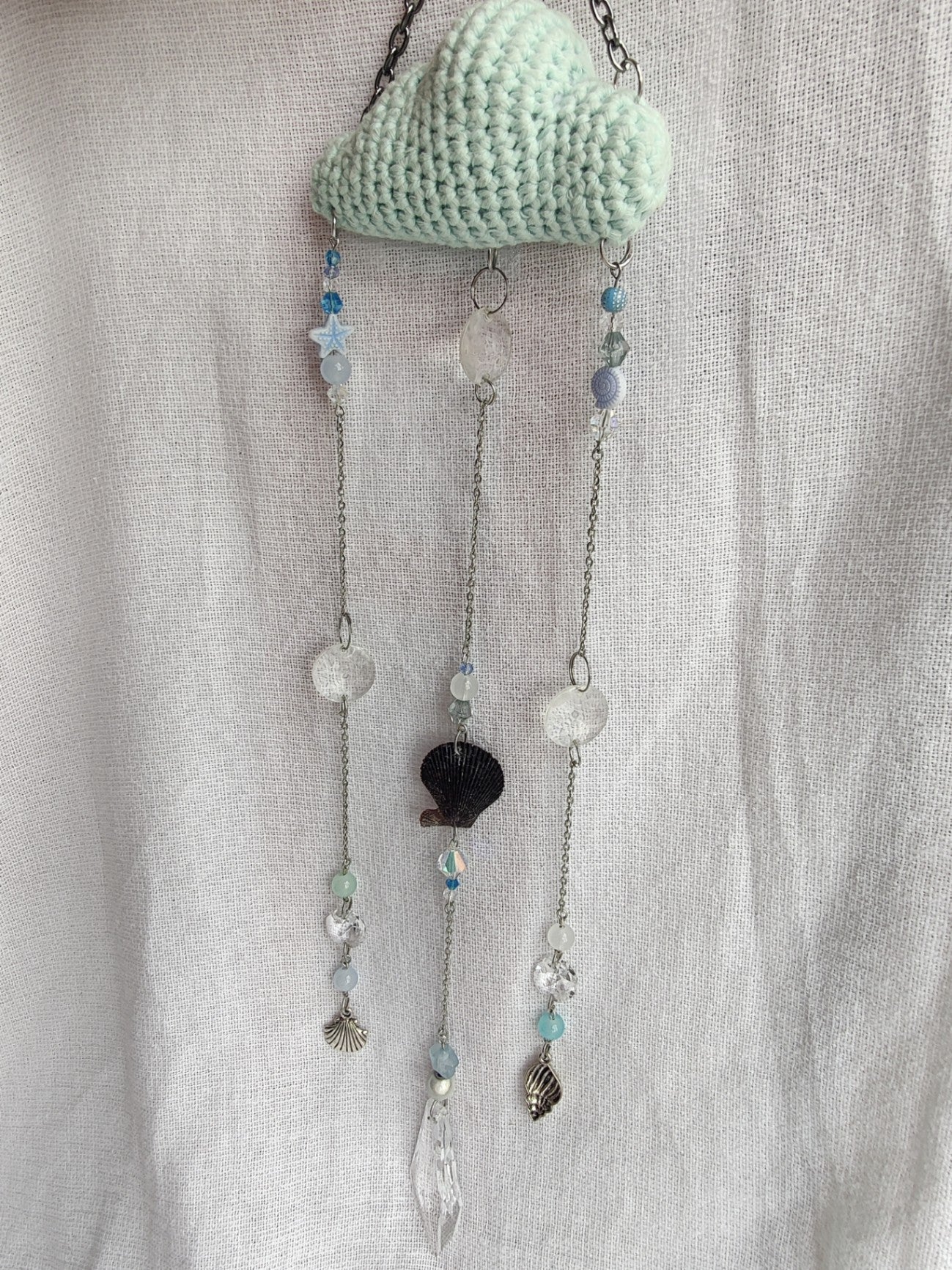 Crochet cloud suncatcher with shell