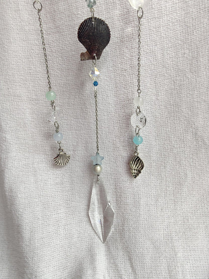 Crochet cloud suncatcher with shell