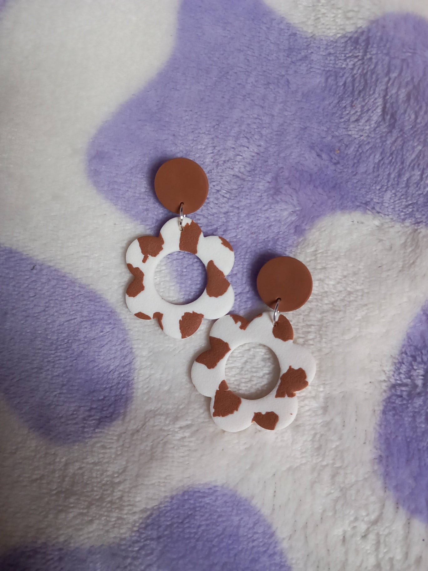 Textured cow print daisy earrings