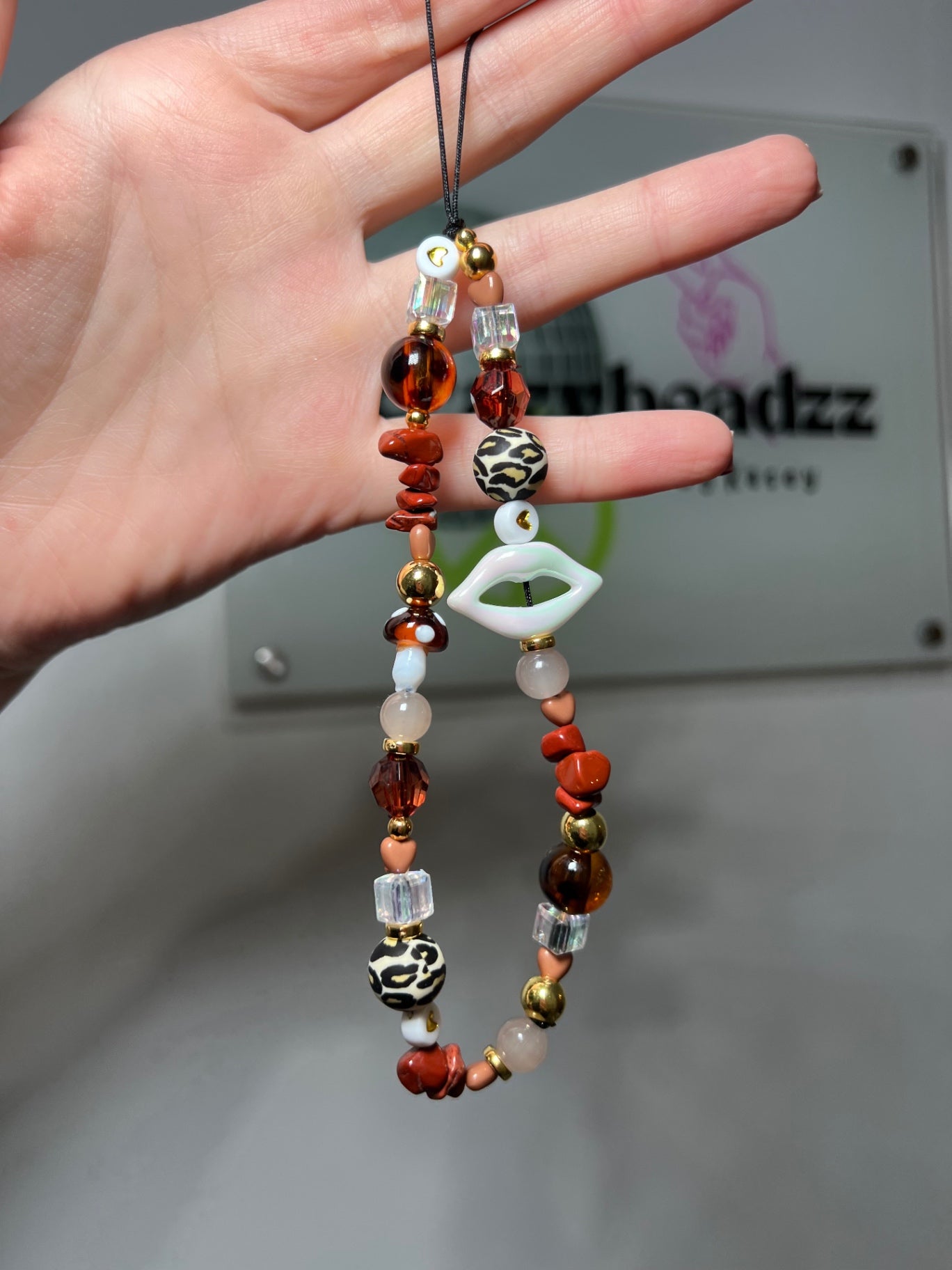 Cat eye phone charm 
