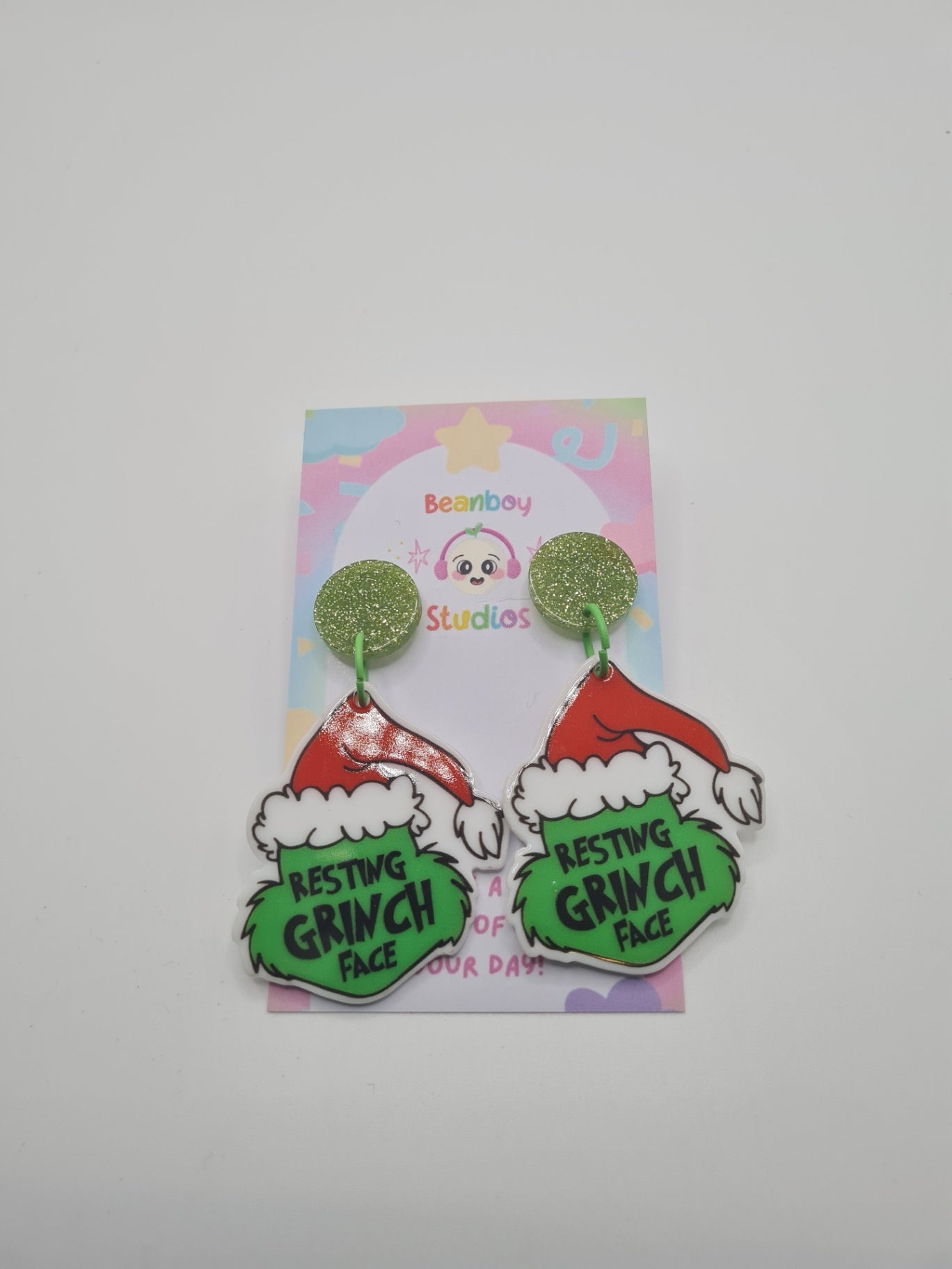 resting green face Christmas earrings