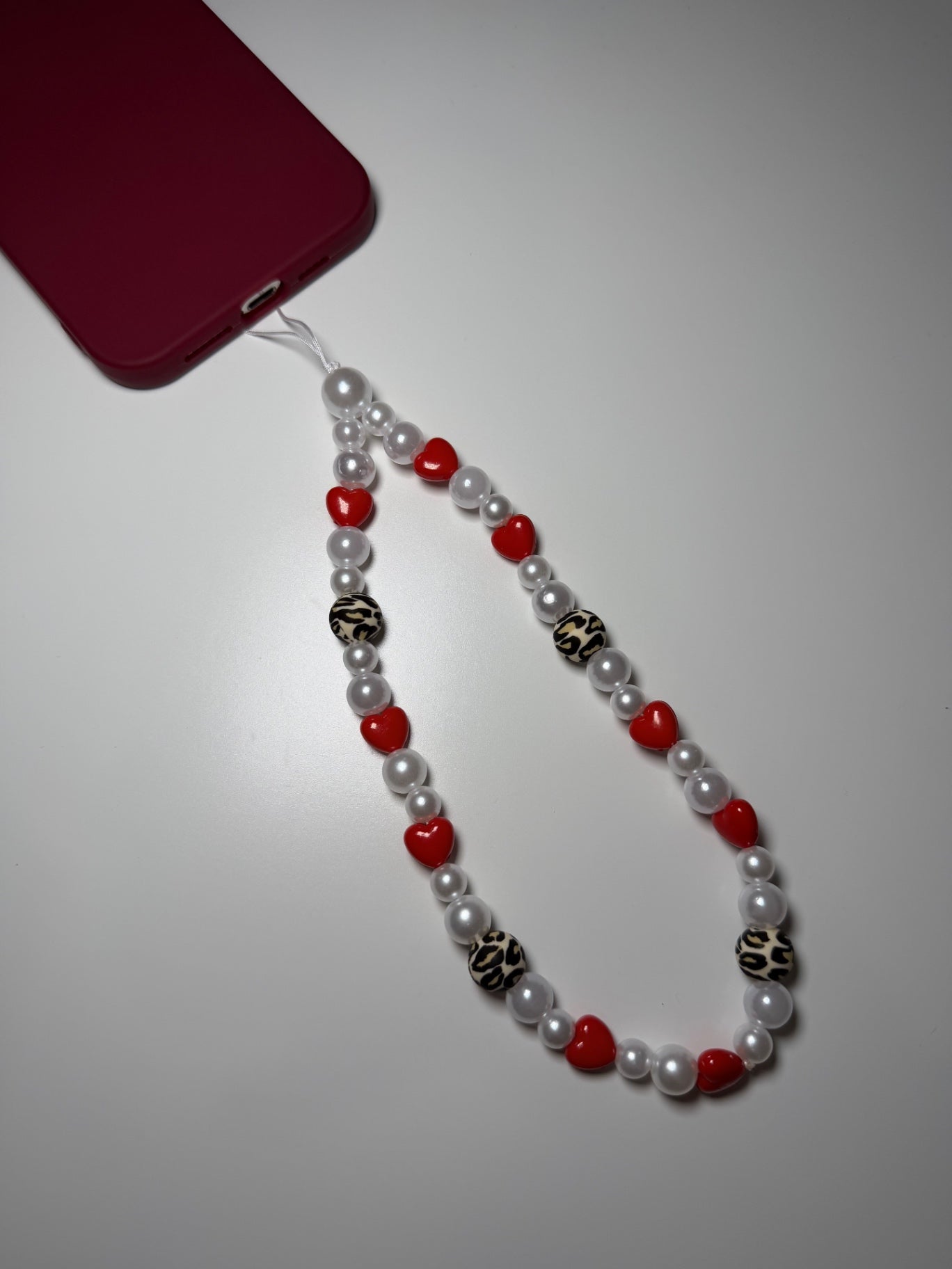 Winter leopard phone charm - red