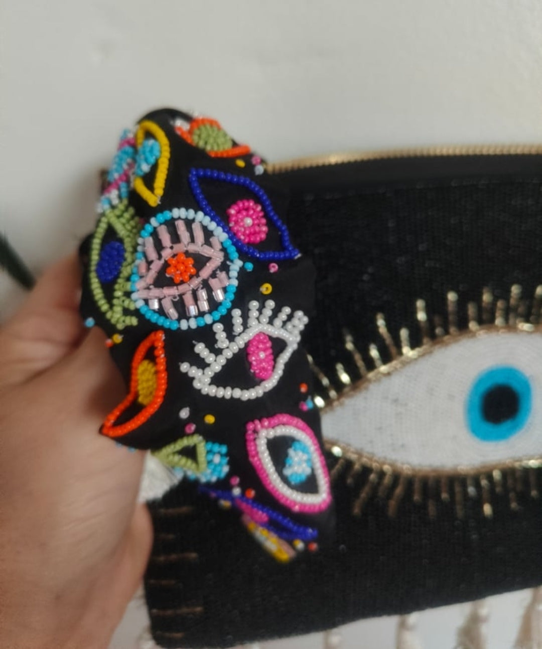 Evil eye protection bag with multi coloured headband to match