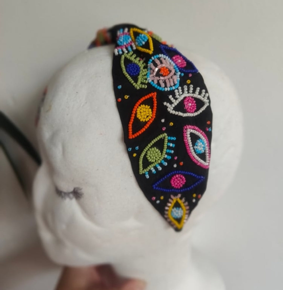Evil eye protection bag with multi coloured headband to match