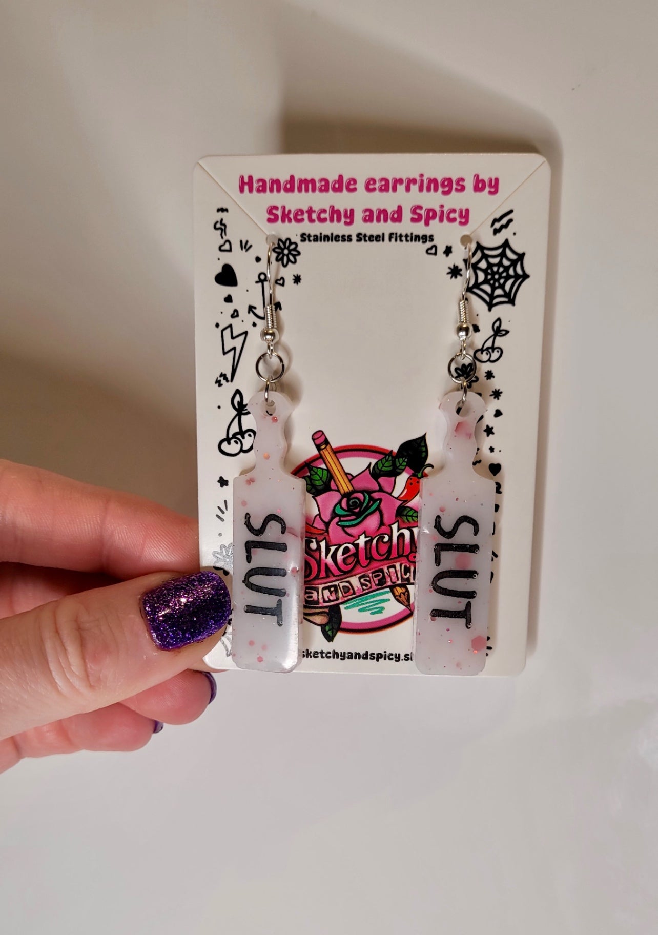 White with Red Flecks SLUT paddle earrings