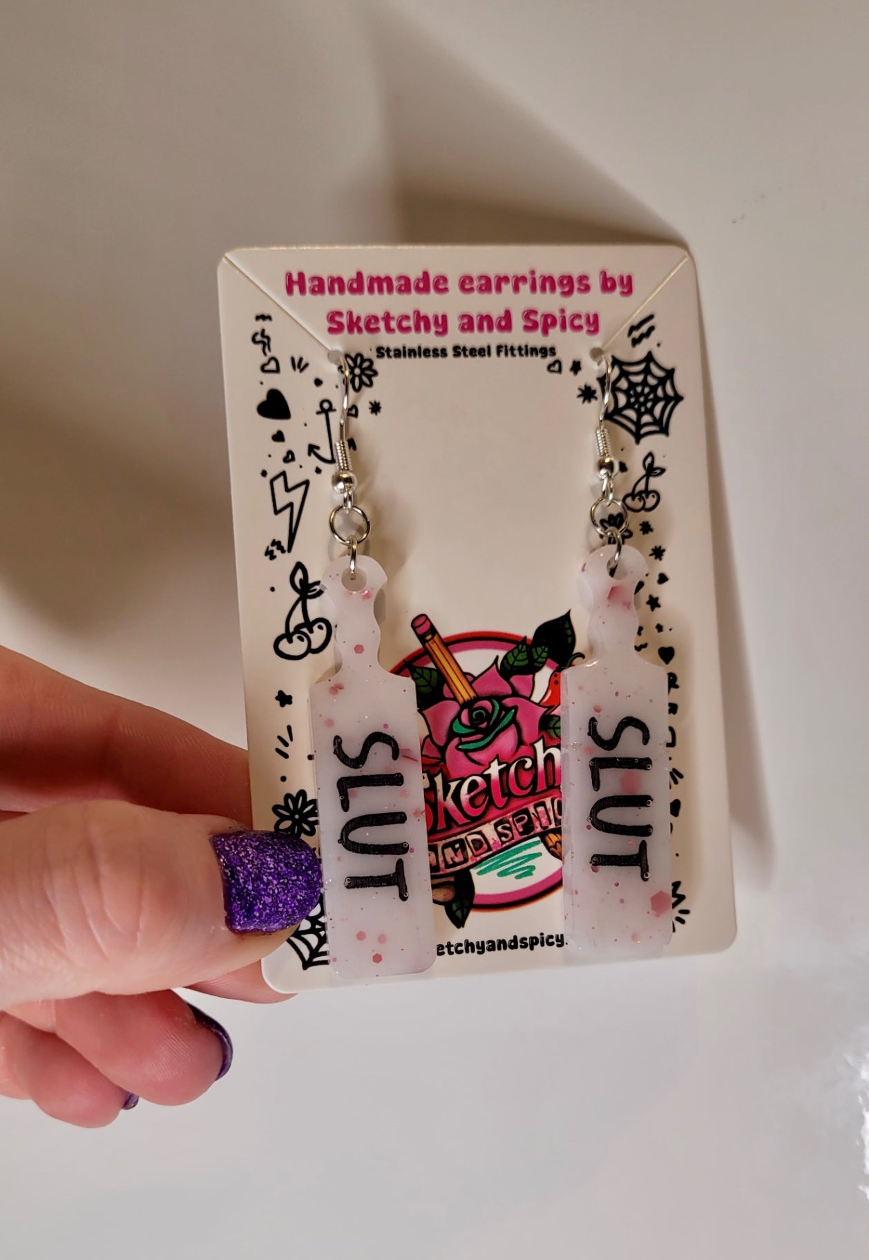 White with Red Flecks SLUT paddle earrings