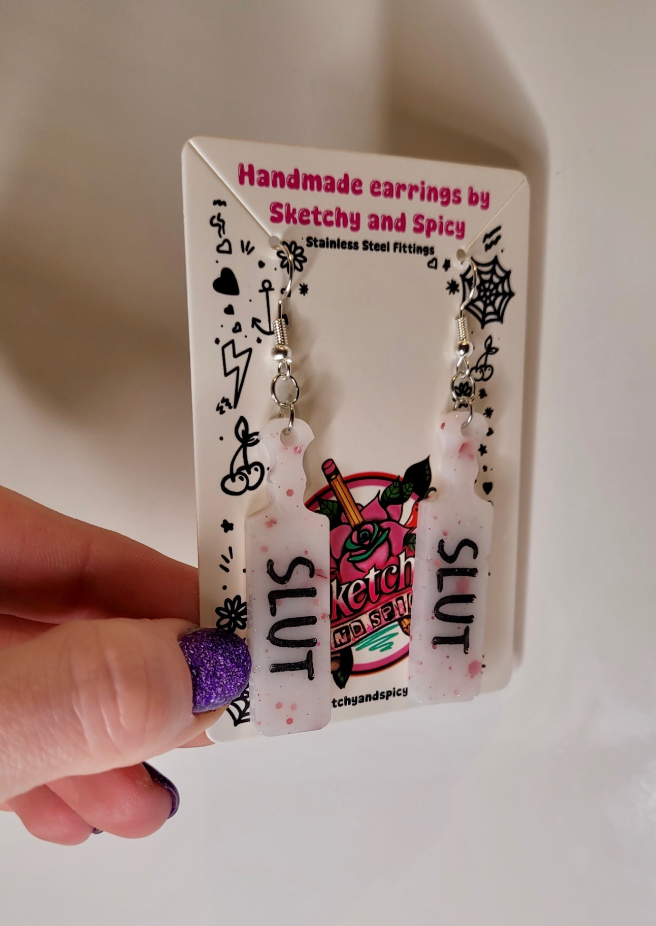 White with Red Flecks SLUT paddle earrings