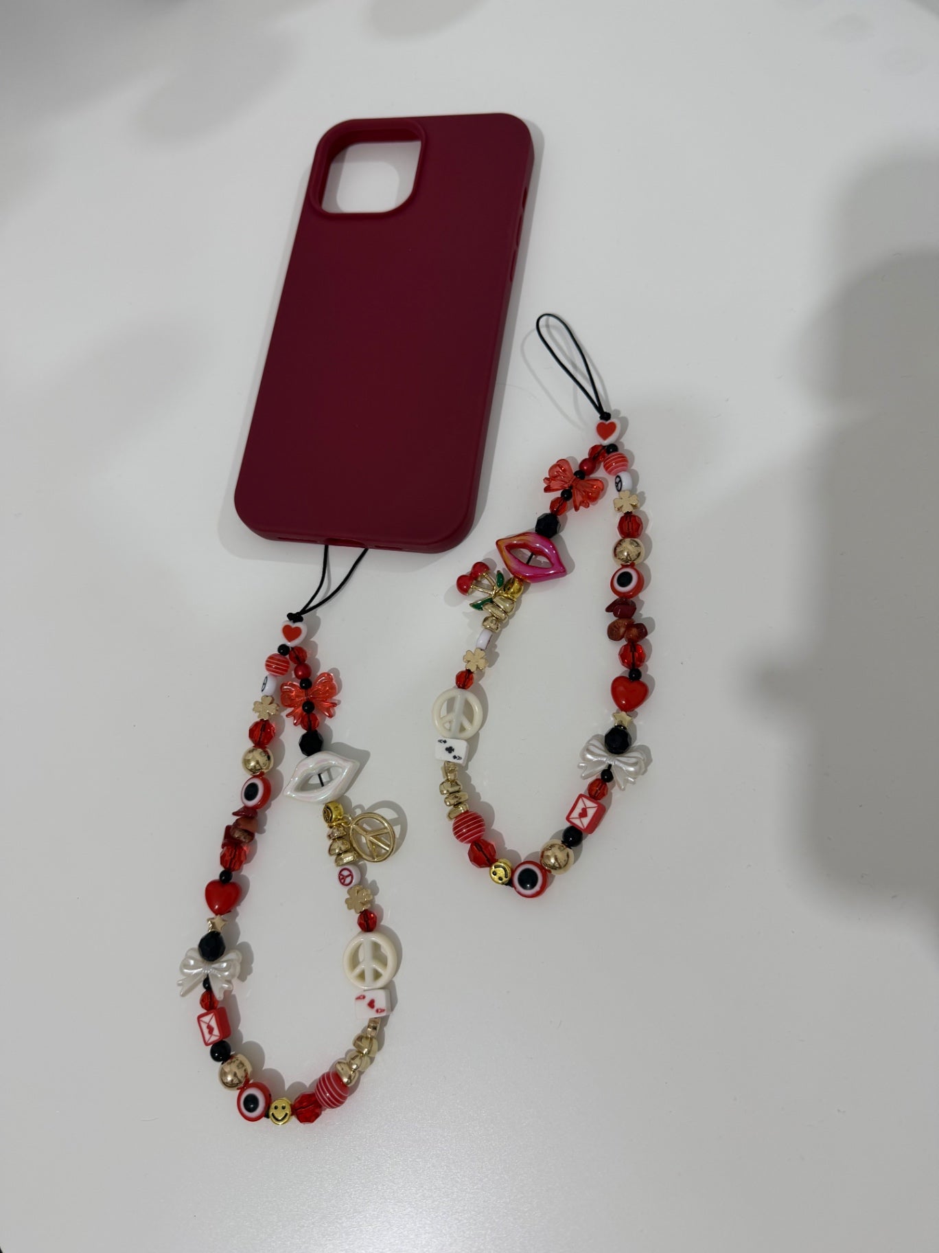 Red Temptation phone charm - gold