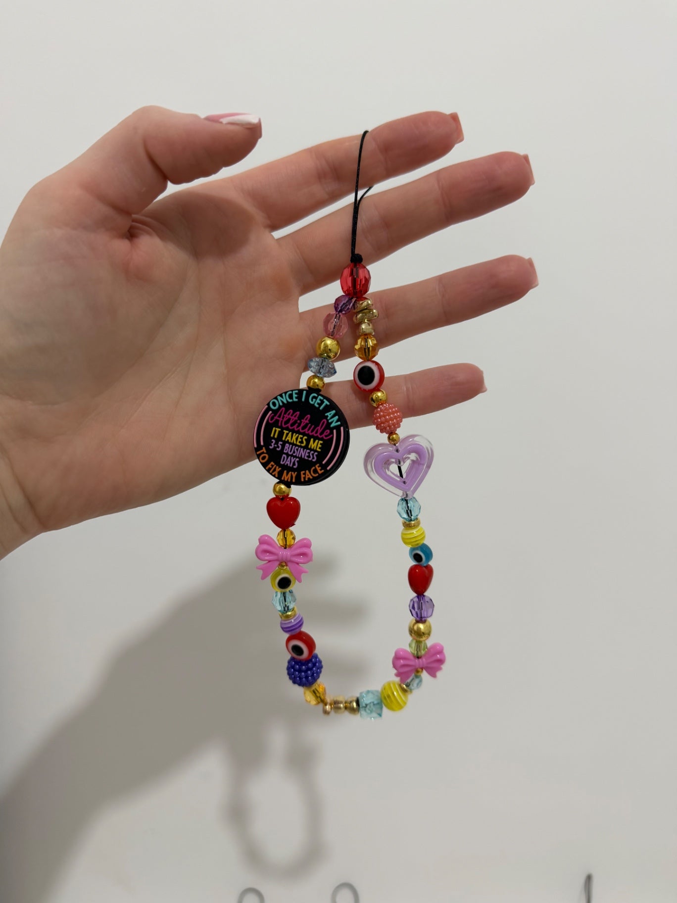 ‘3-5 business days’ phone charm - gold