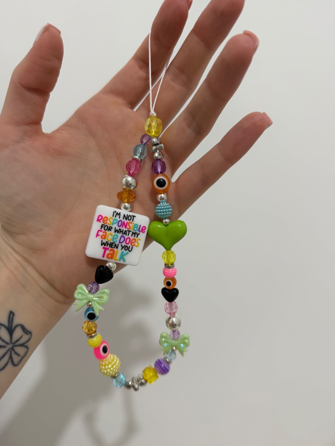 ‘Not responsible for my face’ phone charm - silver